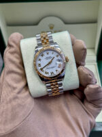 Elegant Rolex Datejust 31 model 178273 featuring a pristine white Roman dial, a harmonious blend of style and sophistication. The Jubilee bracelet adds a touch of luxury to this timeless timepiece. Perfect for any occasion. #Rolex #Datejust31 #LuxuryWatches