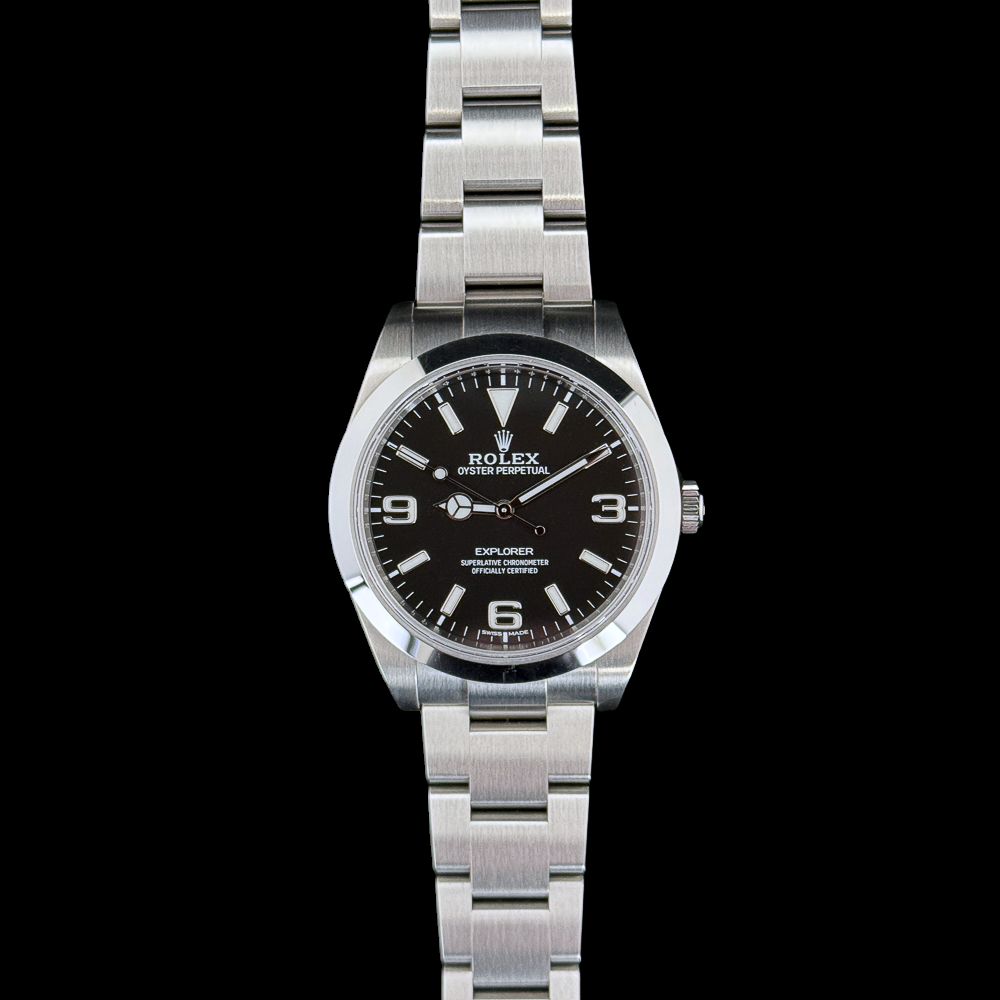 Explore Timeless Elegance with the 2018 Rolex Explorer 214270. This iconic timepiece combines precision engineering with classic design, featuring a robust stainless steel case, a black dial with luminous markers, and the signature Mercedes hands. The self-winding movement ensures accuracy, while the scratch-resistant sapphire crystal provides durability. Elevate your style with this sophisticated and reliable companion for any adventure.