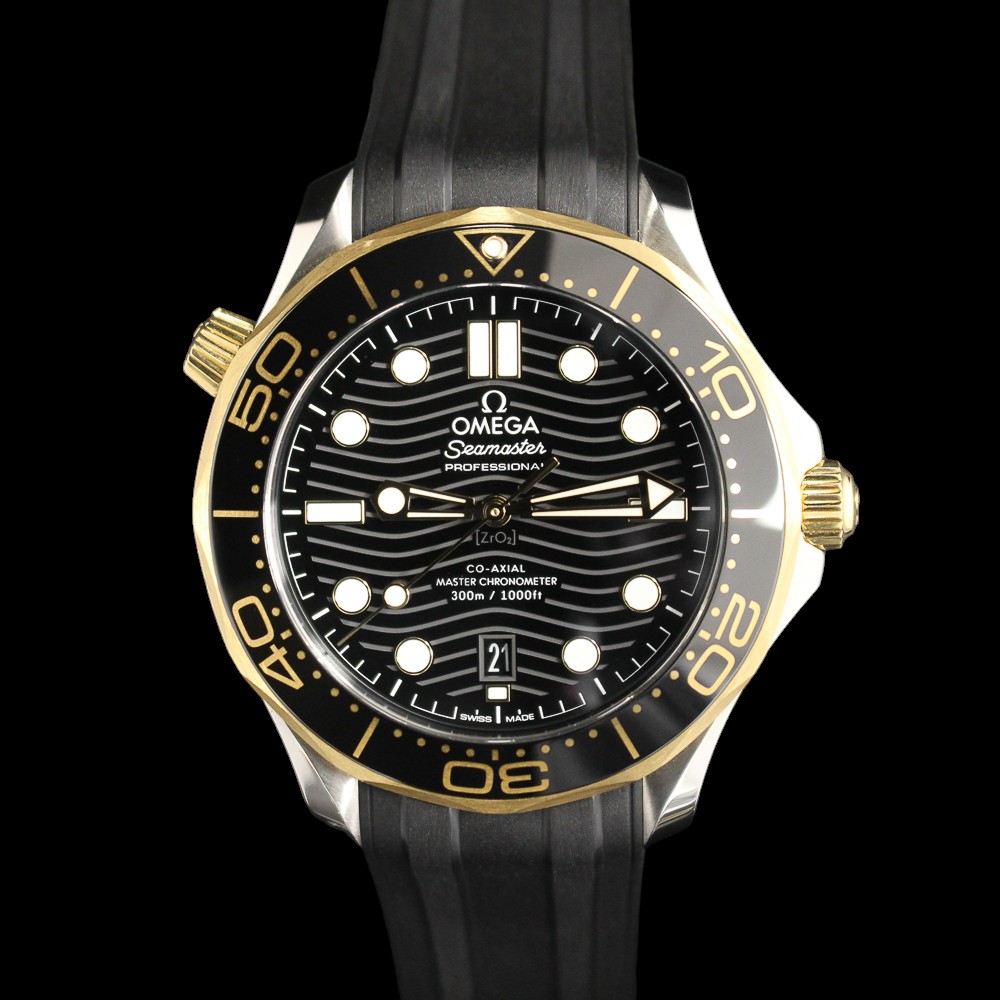 2023 Omega Seamaster Diver in gold and steel with a black dial complete set in MN